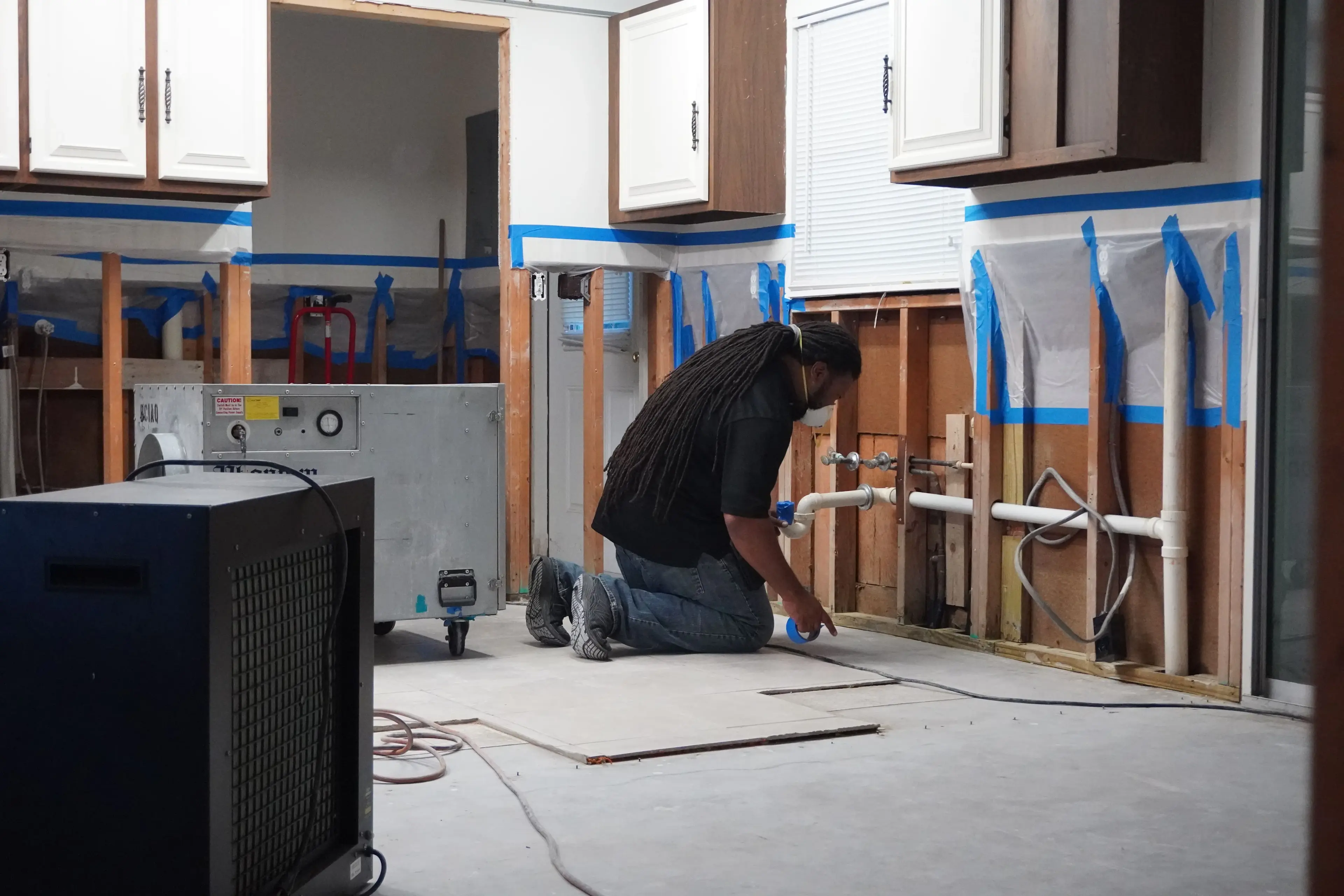 Exposed framing during structural drying work